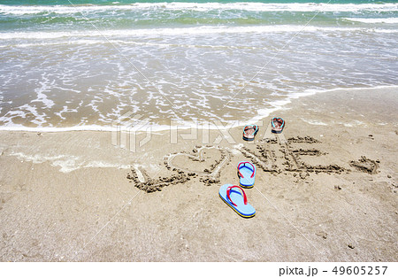 Slippers with love handwritten on the beach Slippers with love handwritten on the beach 49605257