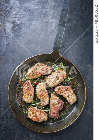 Fried saddle of pork steak with herb  49606562