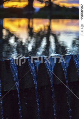 Water fountain sunset detail shot 49606902