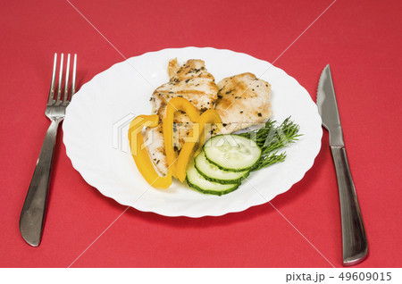 grilled chicken fillet on white plate grilled chicken fillet on white plate 49609015