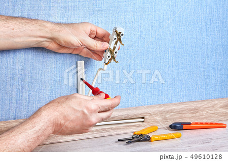 Instaling of new electric socket. 49610128