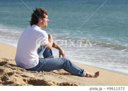 Man thinking and watching the sea Man thinking and watching the sea 49611372