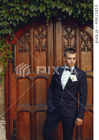 Groom in a park 49615853