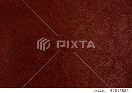 Close-up brown leather texture to background. Close-up brown leather texture to background. 49617826