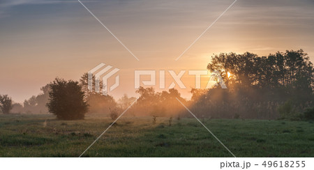 Landscape with meadow near river 49618255