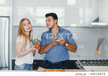couple at home in a kitchen 49618879