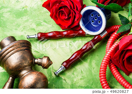 Smoking hookah with rose flavor 49620827