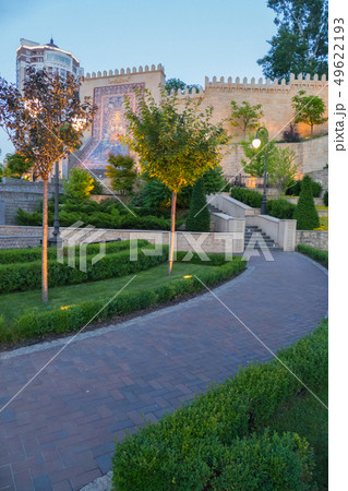 A promenade with stairs leading to a wall with an 49622193