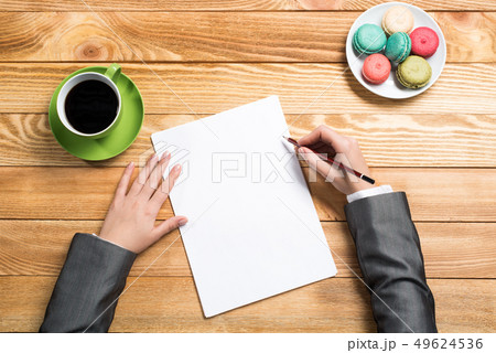 Businesswoman making some notes Businesswoman making some notes 49624536
