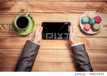 Businesswoman having coffee break Businesswoman having coffee break 49624645