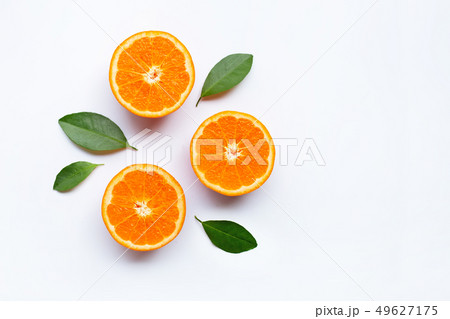 Fresh orange citrus fruits with leaves on white Fresh orange citrus fruits with leaves on white 49627175