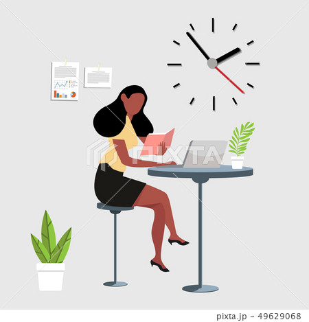 woman reading a book with computer workspace woman reading a book with computer workspace 49629068