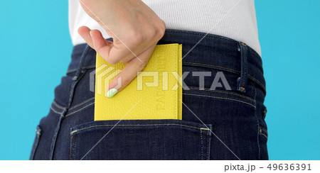 Closeup woman with passport Closeup woman with passport 49636391