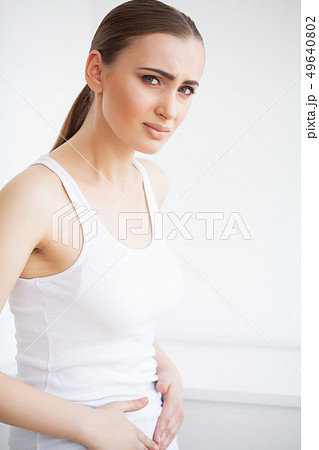 Stomach pain. Woman having painful stomachache,Female suffering from abdominal pain 49640802