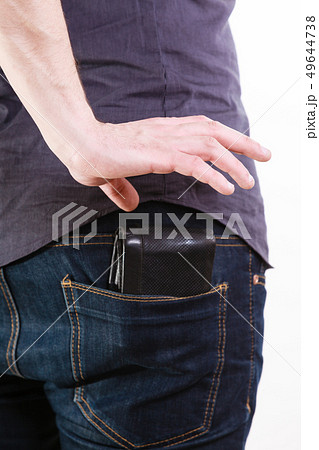 Closeup. Thief stealing wallet from back pocket of 49644738
