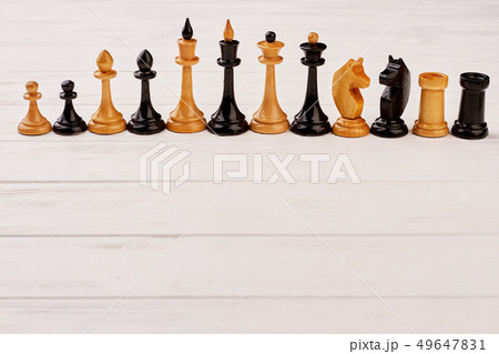 Chess pieces composition on white background. Chess pieces composition on white background. 49647831