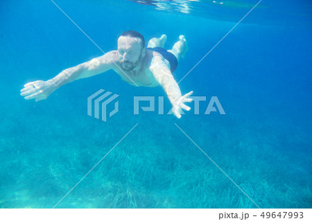 Man diving swimming underwater view 49647993