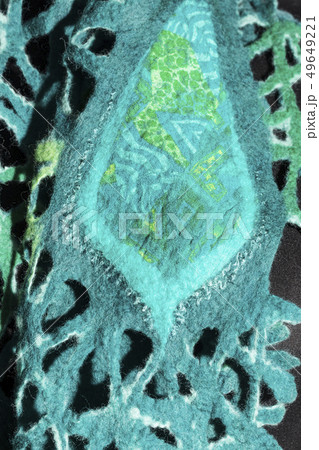 Fragment of a female emerald scarf of felted wool 49649221