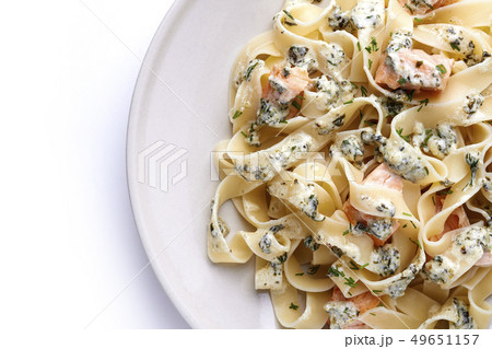 plate of fettuccine with salmon 49651157