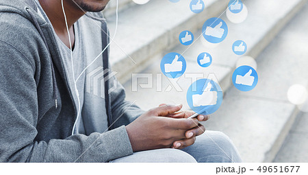 Man using smartphone, playing social media and website 49651677