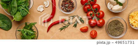 Spices and ingredients for homemade pizza on wooden table Spices and ingredients for homemade pizza on wooden table 49651731