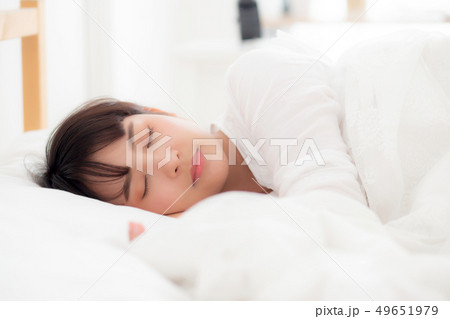 Beautiful asian young woman sleeping lying in bed Beautiful asian young woman sleeping lying in bed 49651979
