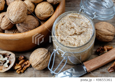Glass jar of raw organic walnut butter or paste. Glass jar of raw organic walnut butter or paste. 49655361