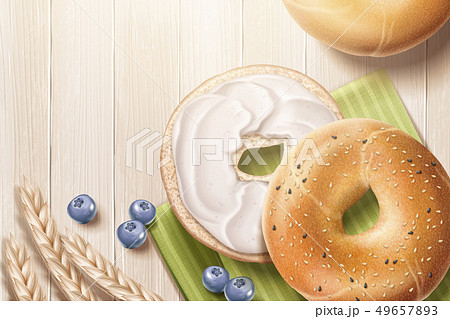 Delicious bagel on wooden table Delicious bagel on wooden table 49657893