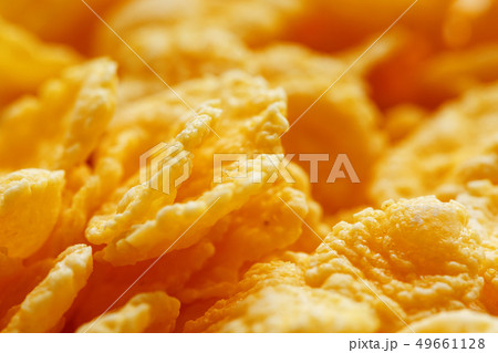Golden cornflakes background and texture. View 49661128