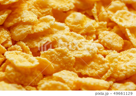 Golden cornflakes background and texture. View 49661129