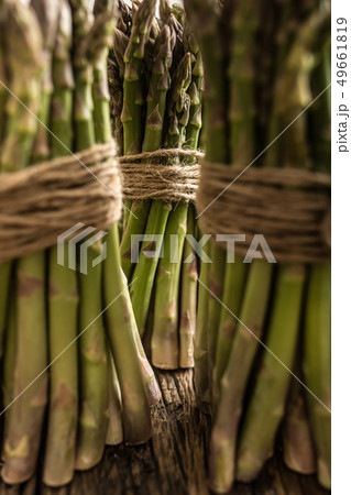Fresh green asparagus on old oak table 49661819