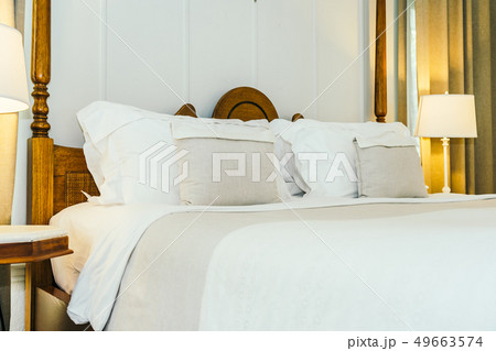 White pillow on bed decoration in beautiful luxury bedroom interior White pillow on bed decoration in beautiful luxury bedroom interior 49663574
