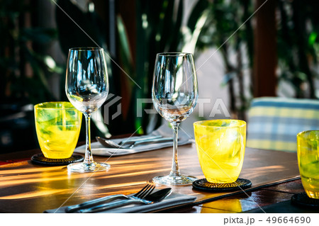 Wine glass with dining set prepare for breakfast lunch or dinner on table in restaurant Wine glass with dining set prepare for breakfast lunch or dinner on table in restaurant 49664690