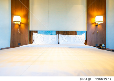 Beautiful comfortable white pillow on bed Beautiful comfortable white pillow on bed 49664973