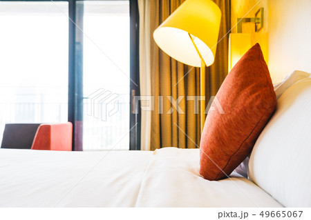 White comfortable pillow on bed decoration White comfortable pillow on bed decoration 49665067