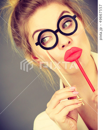 Happy elegant woman holding carnival accessoies on Happy elegant woman holding carnival accessoies on 49667557