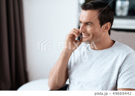 Portrait of Handsome Smiling Person Talking Phone 49669442