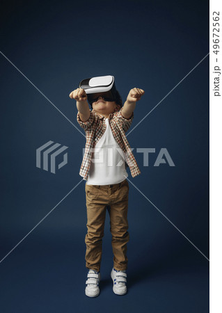 Child with virtual reality headset 49672562