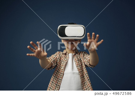 Child with virtual reality headset Child with virtual reality headset 49672586