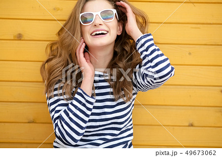 Pointing copy space. Bright studio portrait of attractive young woman pointing copyspace with her 49673062