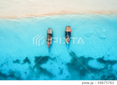 Aerial view of the fishing boats in clear blue 49675763