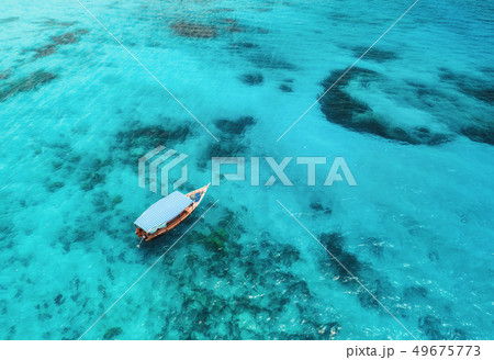 Aerial view of the fishing boat in blue sea Aerial view of the fishing boat in blue sea 49675773