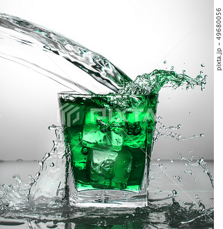 glass with ice and liquid splash glass with ice and liquid splash 49680056