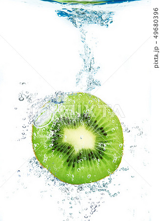 fresh kiwi falling in water 49680396