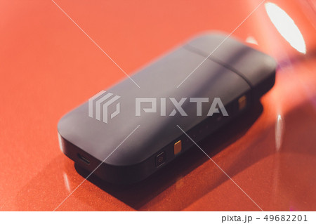 Newest electronic cigarettes, heating tobacco system IQOS, smoking. Newest electronic cigarettes, heating tobacco system IQOS, smoking. 49682201