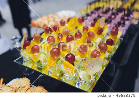 buffet table - a lot of canapes and sandwiches, shallow DOF. buffet table - a lot of canapes and sandwiches, shallow DOF. 49683379