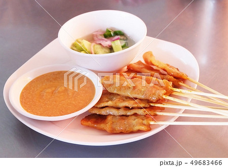 Grilled Pork Satay with Cucumber Salad Grilled Pork Satay with Cucumber Salad 49683466