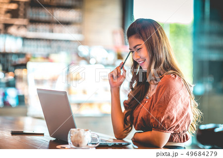 woman working with computer laptop and thinking to woman working with computer laptop and thinking to 49684279