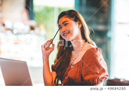 woman working with computer laptop and thinking to woman working with computer laptop and thinking to 49684280