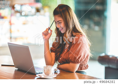 woman working with computer laptop and thinking to 49684281